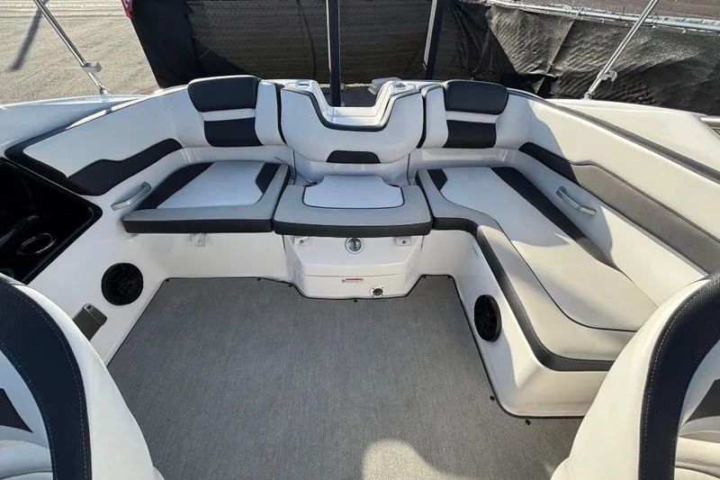 Slide: The Image of 2022 Yamaha Boats SX195 interior with spacious seating and modern design. - 55