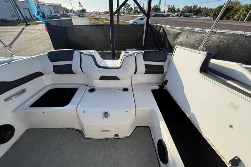 Slide: The Image of 2022 Yamaha Boats SX195 interior with seating and storage compartments. - 56