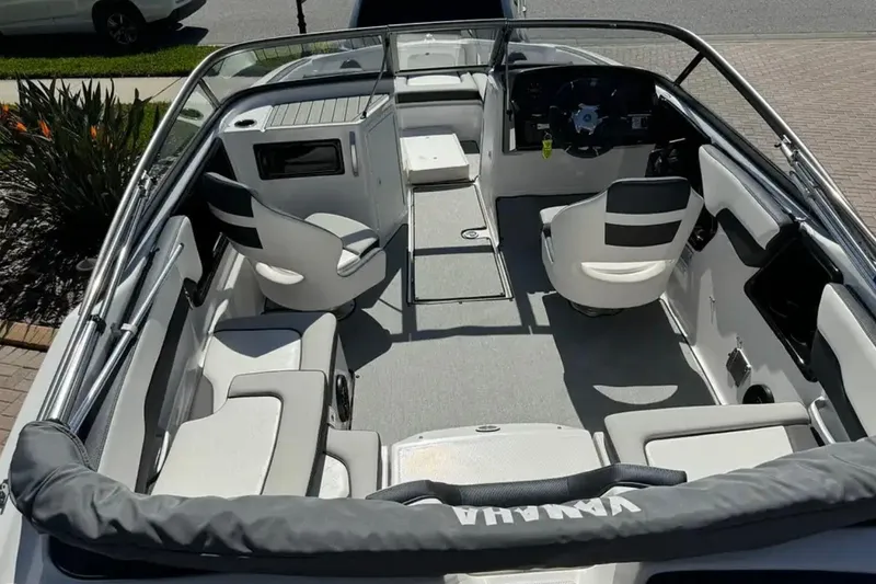 Slide: The Image of 2022 Yamaha Boats SX195 interior with seating and steering wheel, showcasing modern design. - 6