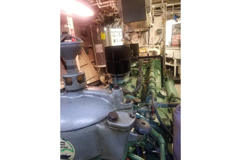 Slide: The Image of Engine room of a 1974 Custom Steel Cannery Tender, showcasing machinery and components. - 16