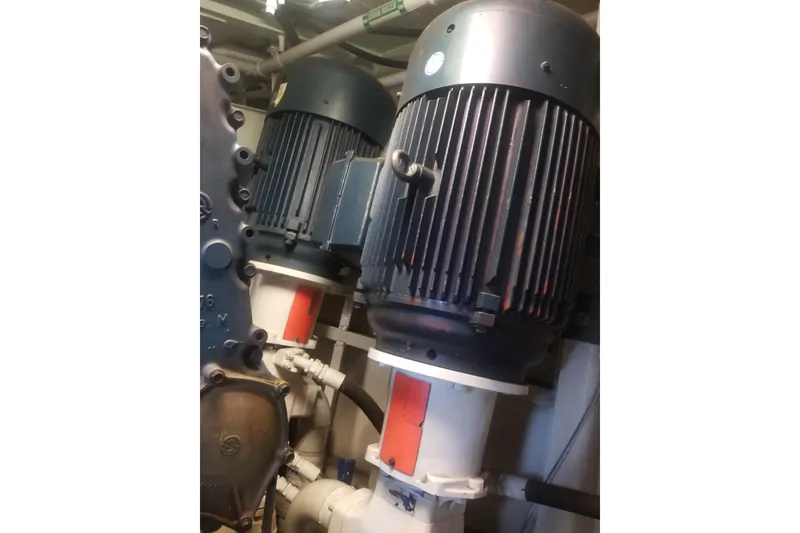 Slide: The Image of 1974 Custom Steel Cannery Tender engine room with industrial machinery and piping. - 17