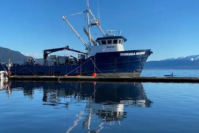 Slide: The Image of Custom 1974 Steel Cannery Tender docked on calm water with mountain backdrop. - 24