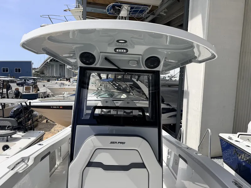 Slide: The Image of 2026 Sea Pro 242 DLX boat in harbor, modern design. - 6