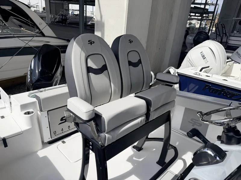 Slide: The Image of 2026 Sea Pro 242 DLX boat seats in marina. - 12