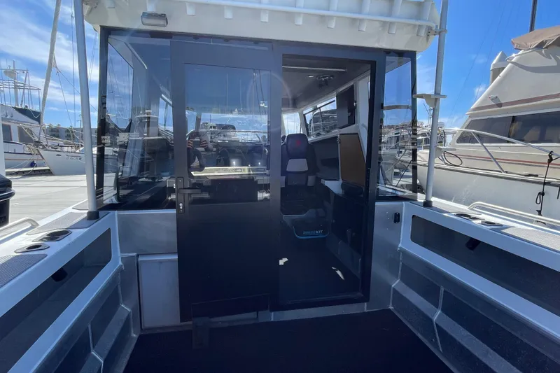 Slide: The Image of 2017 Stabicraft 2500 Ultracab XL boat docked in marina, featuring sleek design and advanced navigation equipment. - 13