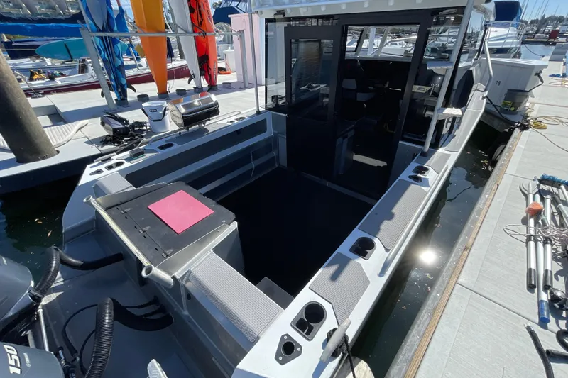 Slide: The Image of 2017 Stabicraft 2500 Ultracab XL boat with Lewmar winch and docked sailboats in background. - 15