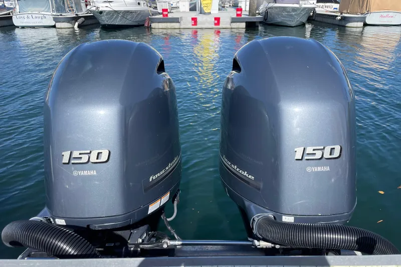 Slide: The Image of 2017 Stabicraft 2500 Ultracab XL boat with rod holders, docked under clear blue sky. - 18