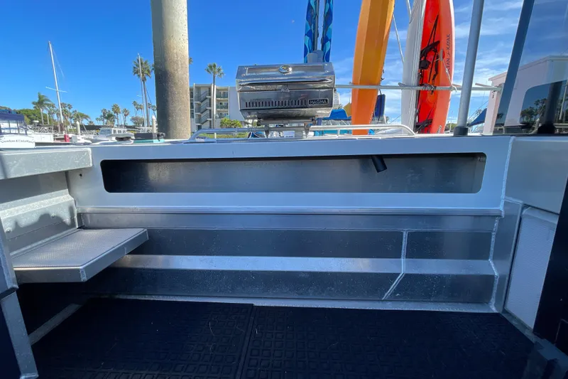 Slide: The Image of 2017 Stabicraft 2500 Ultracab XL boat deck with dual engines at marina. - 20