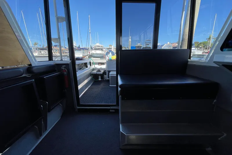 Slide: The Image of Interior of 2017 Stabicraft 2500 Ultracab XL with two black and white seats. - 30