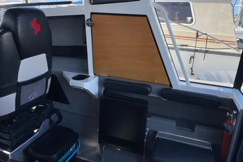 Slide: The Image of 2017 Stabicraft 2500 Ultracab XL interior with seating and helm, showcasing modern design. - 32