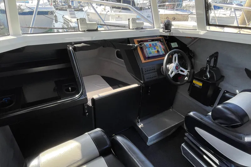 Slide: The Image of Interior of 2017 Stabicraft 2500 Ultracab XL with foldable table and seating. - 37