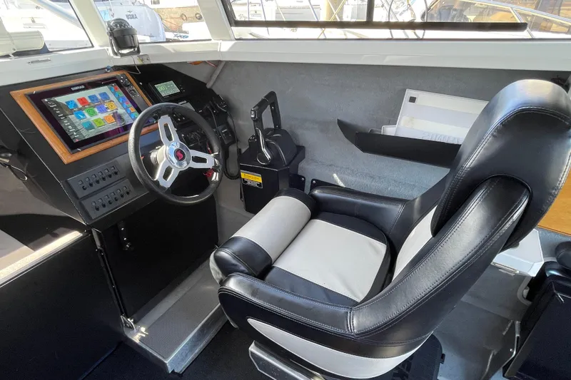 Slide: The Image of Interior of 2017 Stabicraft 2500 Ultracab XL, featuring control panel and seating area. - 38