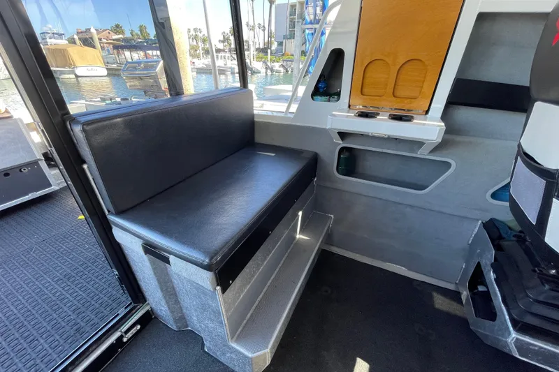 Slide: The Image of Interior of 2017 Stabicraft 2500 Ultracab XL, featuring a modern captain's seat and dashboard. - 44