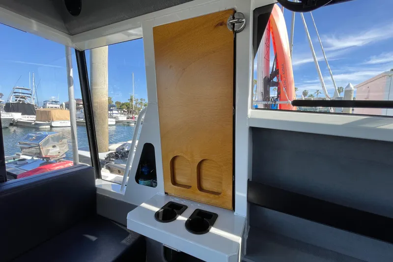 Slide: The Image of 2017 Stabicraft 2500 Ultracab XL interior with captain's chair and dashboard view. - 45