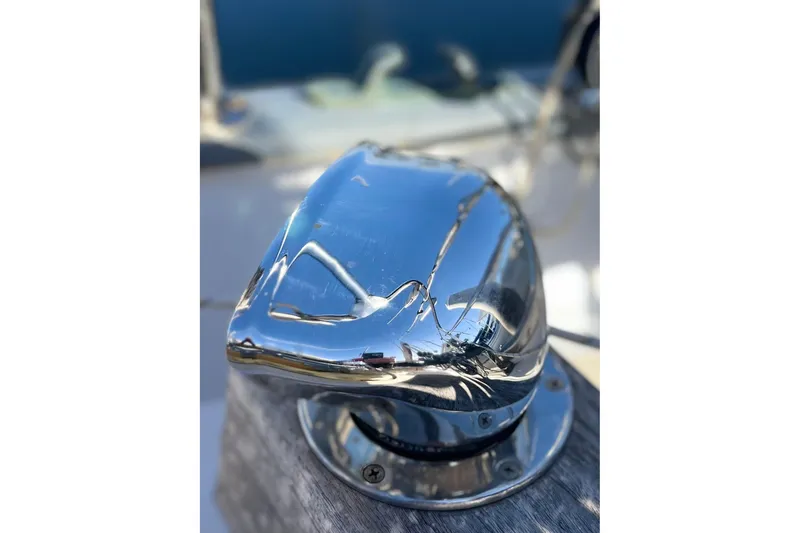 Slide: The Image of Close-up of a polished metal fitting on a 1975 Cape George 36 sailboat. - 30