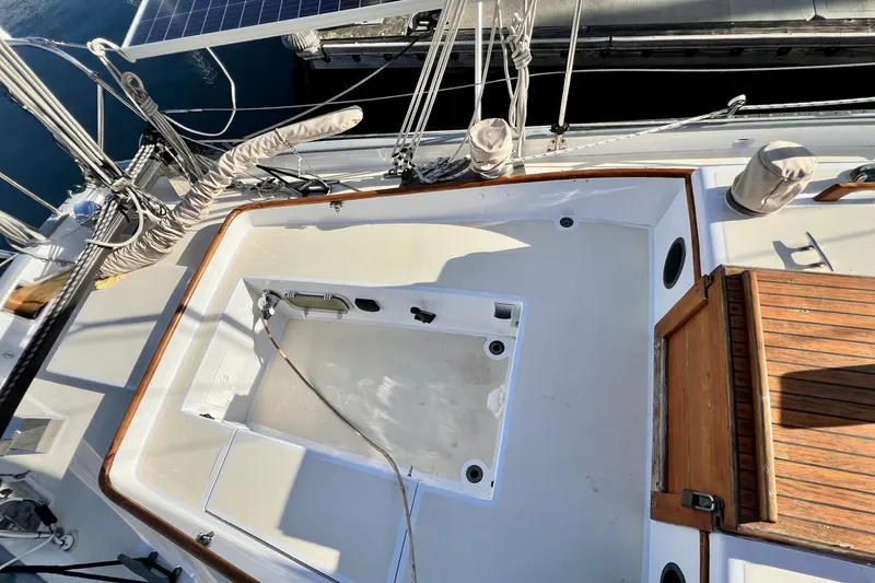 Slide: The Image of Cockpit of a 1975 Cape George 36 sailboat with wooden accents and solar panel. - 32