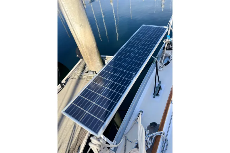 Slide: The Image of Solar panel on 1975 Cape George 36 sailboat, docked with clear water reflection. - 34