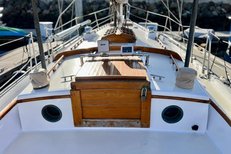 Slide: The Image of 1975 Cape George 36 sailboat deck with wooden hatch and navigation equipment. - 40