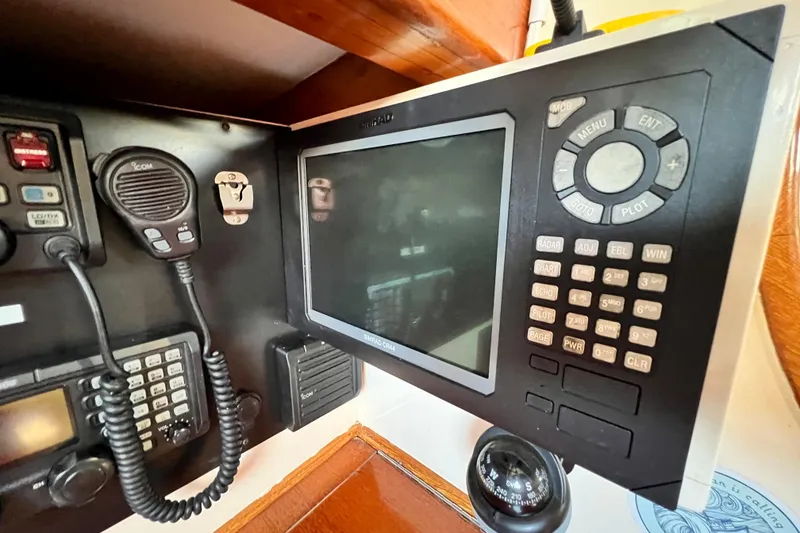 Slide: The Image of Navigation equipment and radio on a 1975 Cape George 36 sailboat. - 49