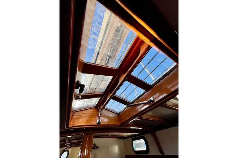 Slide: The Image of Interior view of 1975 Cape George 36 sailboat with wooden skylight. - 59