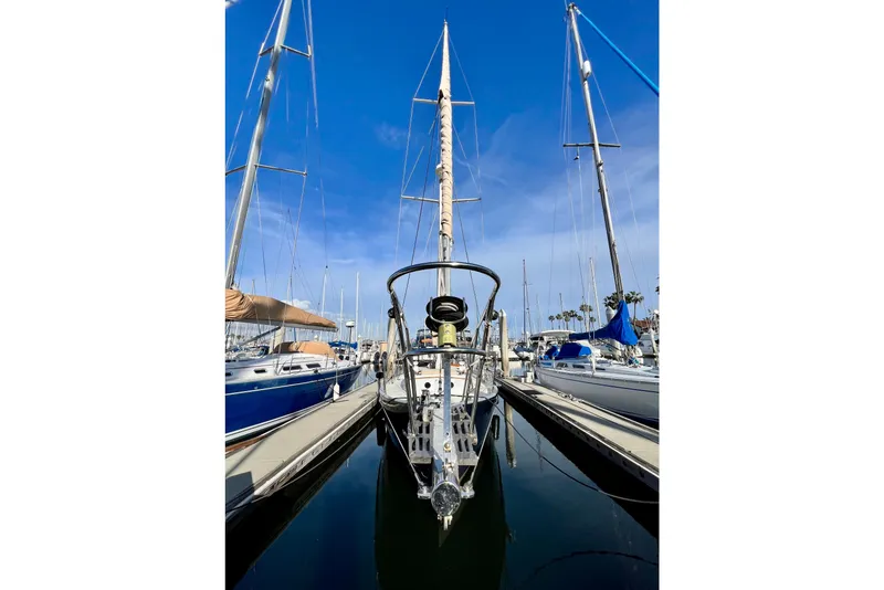 Slide: The Image of Sailboat docked in marina, Cape George 36, 1975 model, clear blue sky. - 6
