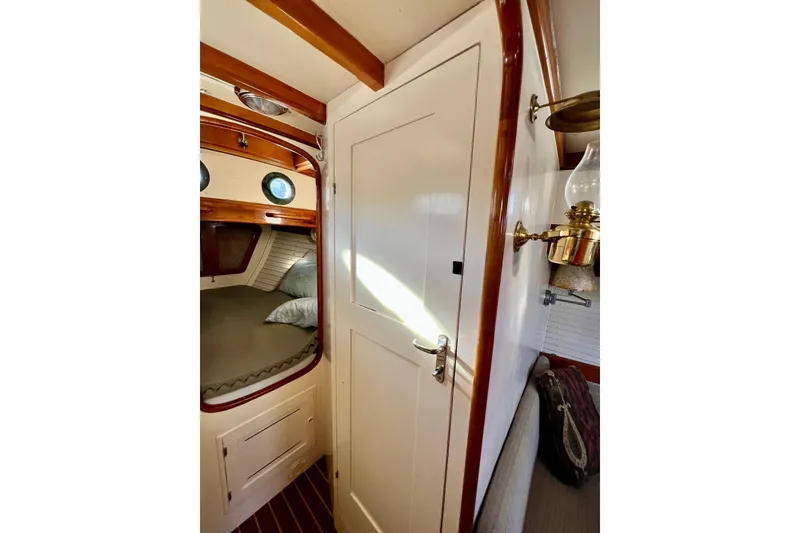 Slide: The Image of Interior of 1975 Cape George 36 sailboat with cozy cabin and vintage decor. - 64