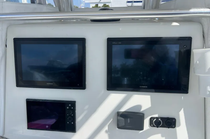 Slide: The Image of Dashboard of 2019 Yellowfin 29 Offshore with Garmin navigation displays. - 10