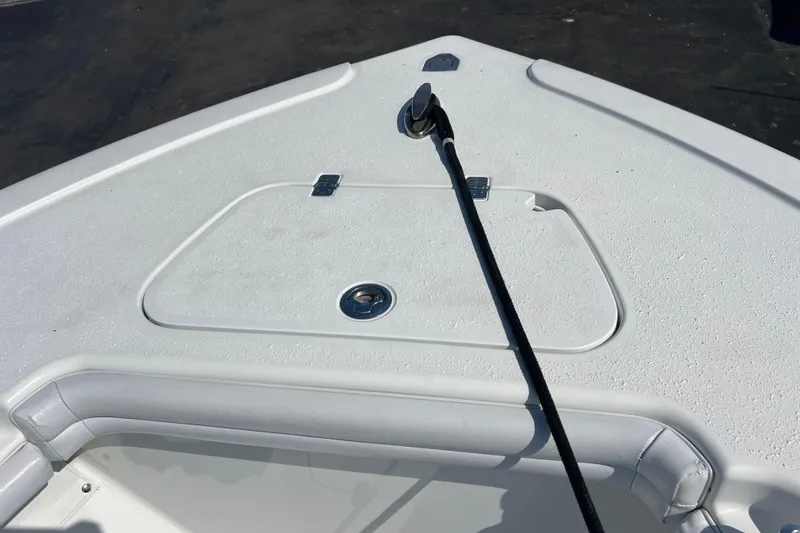 Slide: The Image of 2019 Yellowfin 29 Offshore boat deck with storage compartment and anchor line. - 11