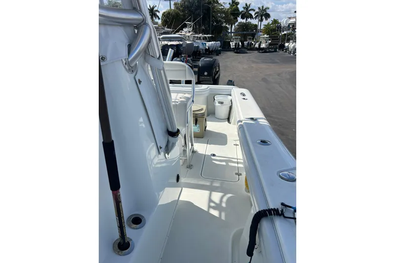 Slide: The Image of 2019 Yellowfin 29 Offshore boat deck with fishing rod holders and storage. - 13