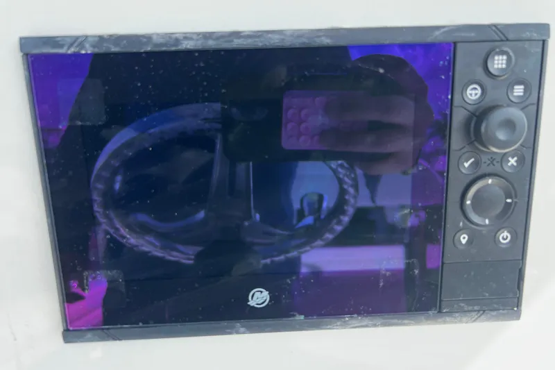 Slide: The Image of Control panel of a 2019 Yellowfin 29 Offshore boat with reflection. - 14