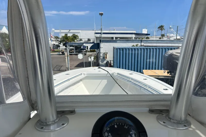 Slide: The Image of 2019 Yellowfin 29 Offshore boat view from cockpit, marina background. - 17