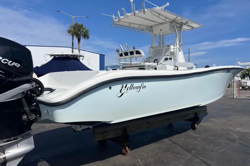 Slide: The Image of 2019 Yellowfin 29 Offshore boat on display, featuring sleek design and powerful outboard engine. - 2