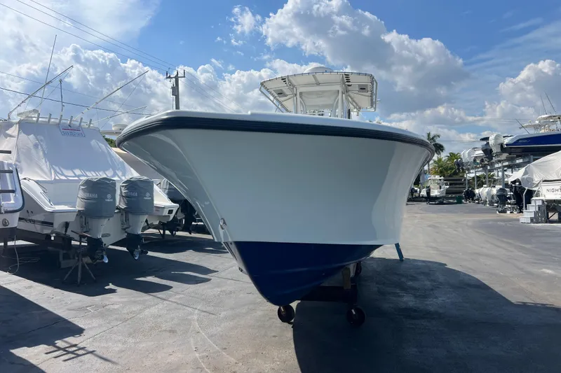 Slide: The Image of 2019 Yellowfin 29 Offshore boat in marina, clear sky background. - 20