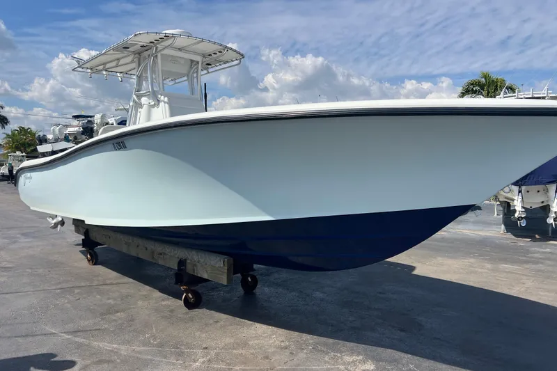 Slide: The Image of 2019 Yellowfin 29 Offshore boat on display under a clear blue sky. - 3