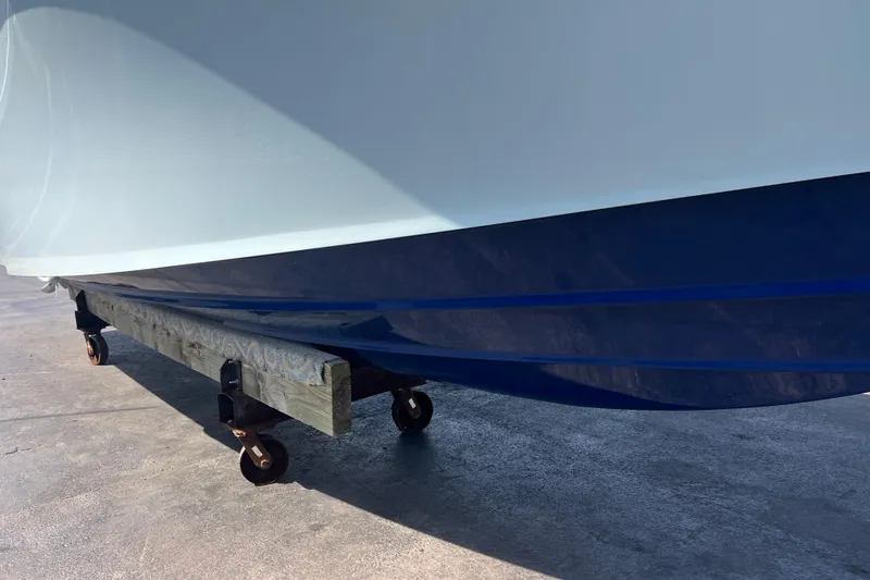 Slide: The Image of 2019 Yellowfin 29 Offshore boat hull on a wheeled support. - 4