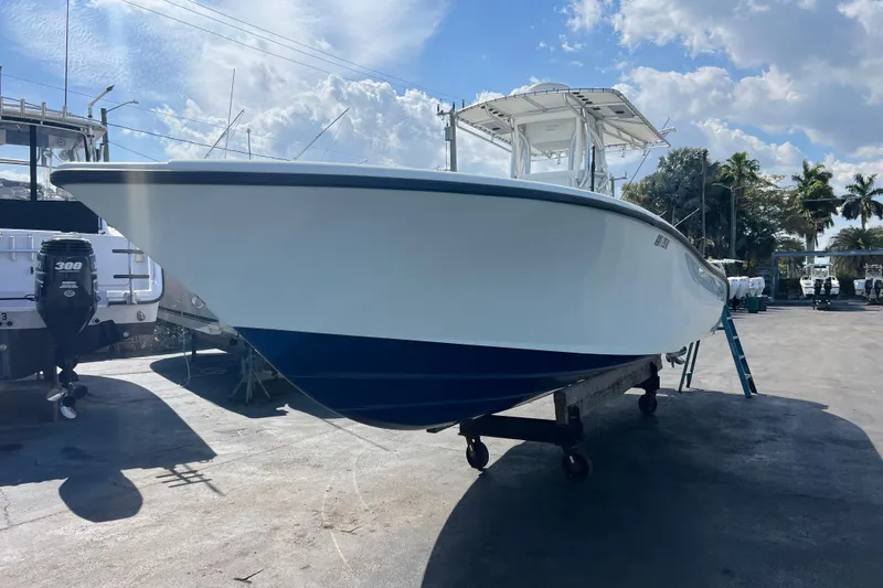 Slide: The Image of 2019 Yellowfin 29 Offshore boat on trailer under blue sky. - 6
