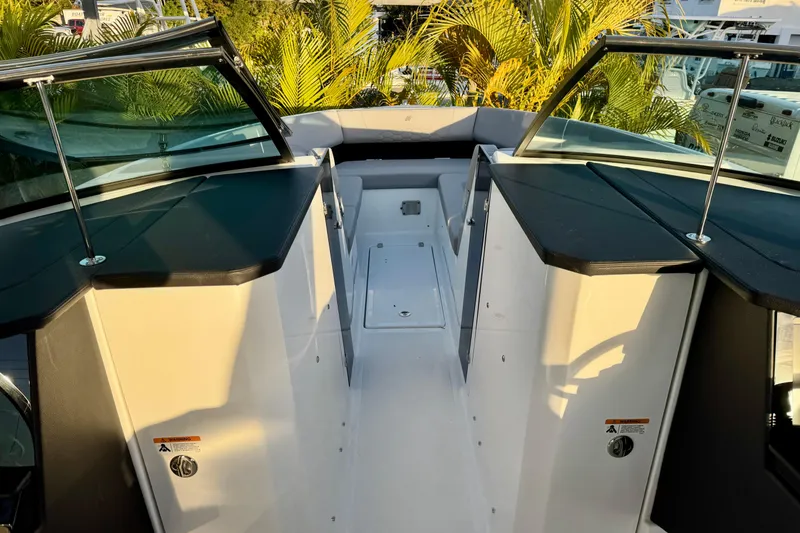 Slide: The Image of 2026 Four Winns H33 OB boat interior with open deck and seating area. - 20