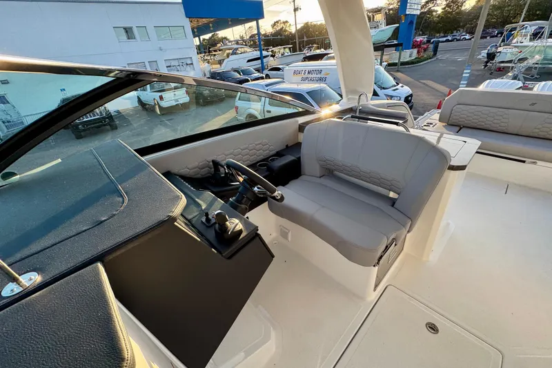 Slide: The Image of 2026 Four Winns H33 OB boat interior with modern helm and seating. - 27