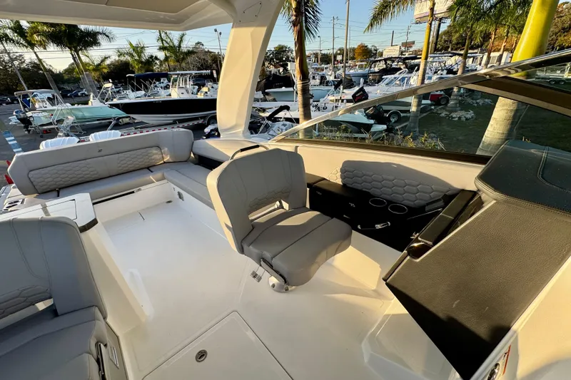 Slide: The Image of 2026 Four Winns H33 OB boat interior with gray seating and modern design. - 28