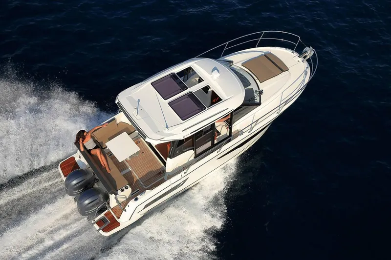 Slide: The Image of Manufacturer Provided Image: 2022 Jeanneau NC Weekender 895 cruising on open water. - 2