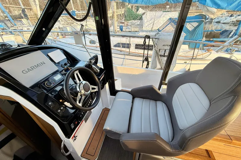 Slide: The Image of Interior of 2022 Jeanneau NC Weekender 895 with Garmin navigation system and comfortable seating. - 28