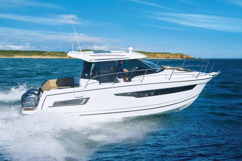 Slide: The Image of Manufacturer Provided Image: 2022 Jeanneau NC Weekender 895 cruising on open water. - 3