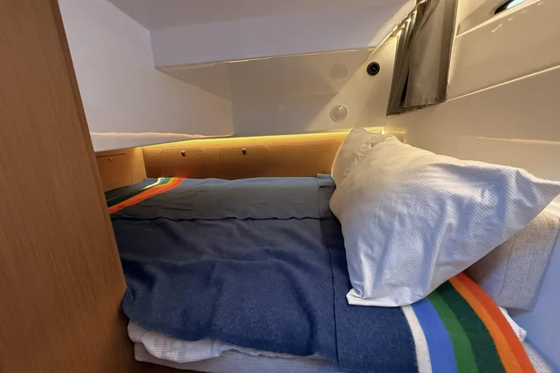 Slide: The Image of Cozy cabin interior of 2022 Jeanneau NC Weekender 895 with colorful bedding. - 32