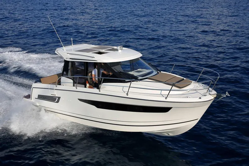 Slide: The Image of Manufacturer Provided Image: 2022 Jeanneau NC Weekender 895 cruising on open water. - 51