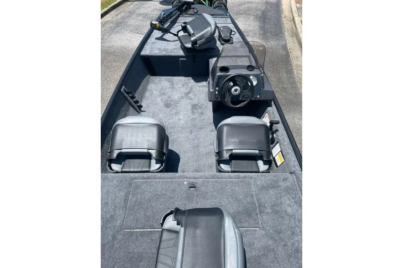 Slide: The Image of 2026 Tracker Bass Tracker Classic XL interior with steering wheel and seating. - 2