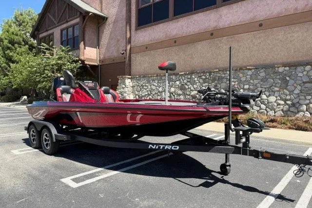 Slide: The Image of 2026 Nitro Z20 XL Pro boat on trailer in parking lot. - 2