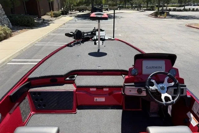 Slide: The Image of 2026 Nitro Z20 XL Pro boat interior with Garmin navigation system, parked outdoors. - 7