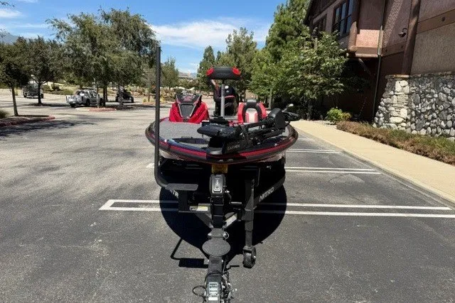 Slide: The Image of 2026 Nitro Z20 XL Pro boat parked in a sunny lot, showcasing sleek design and modern features. - 3