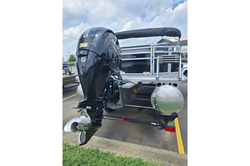 Slide: The Image of 2026 Sun Tracker SportFish 22 DLX pontoon boat with powerful outboard motor. - 5