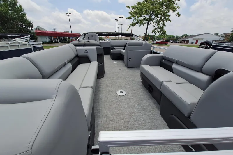 Slide: The Image of 2026 Sun Tracker SportFish 22 DLX pontoon boat with spacious seating and modern design. - 1